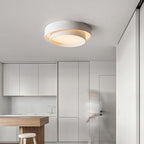 The Clérachic white double-ring ceiling light glows warm above an open kitchen counter.
