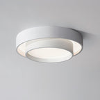 The Clérachic white double-ring ceiling light is shown close up, its acrylic diffuser glowing.