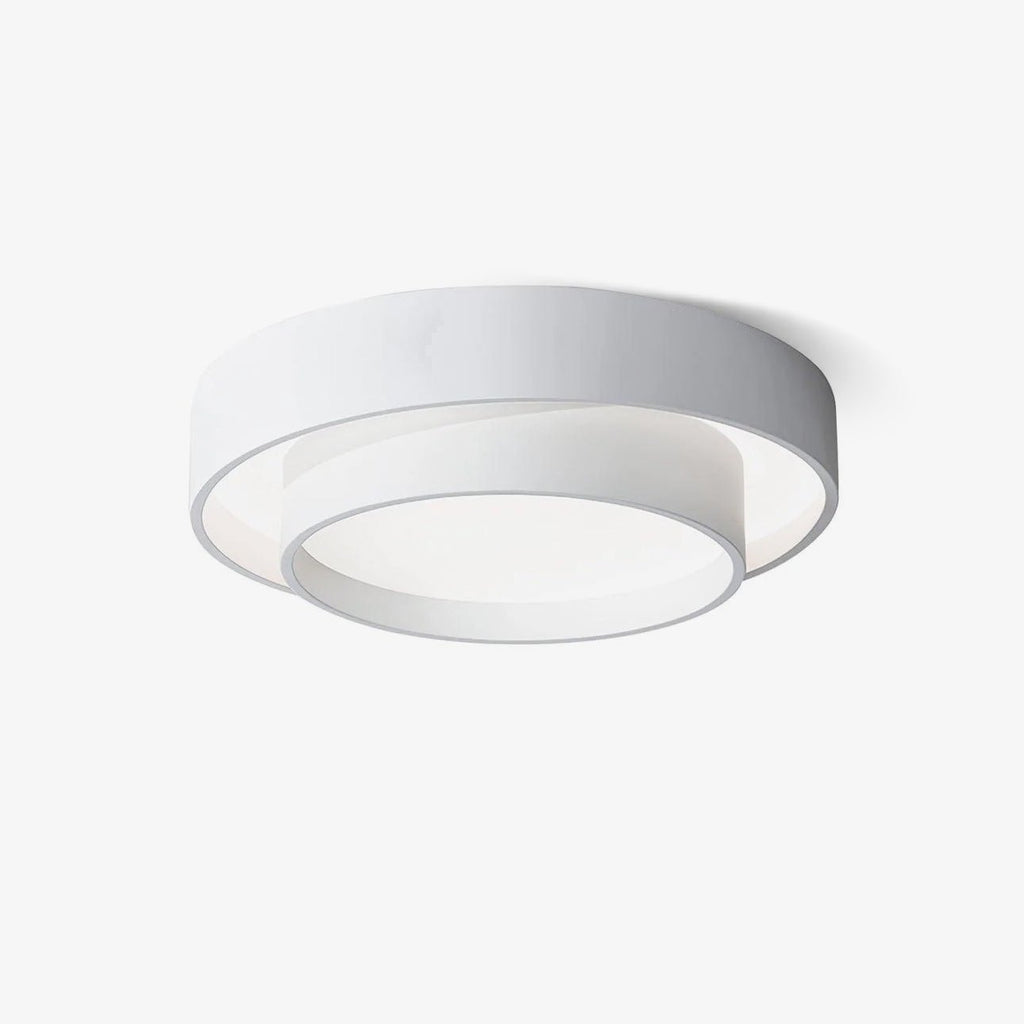 Clérachic's white double-ring flush mount is shown close up and unlit against a plain backdrop.