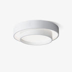 Clérachic's white double-ring flush mount is shown close up and unlit against a plain backdrop.