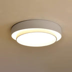 Clérachic's gray double-ring flush mount glows warm in a room bathed in golden amber light.