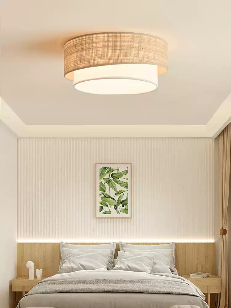 In a bedroom with striped wall panelling and a leaf print, this Clérachic flush-mount casts a soft warm glow.