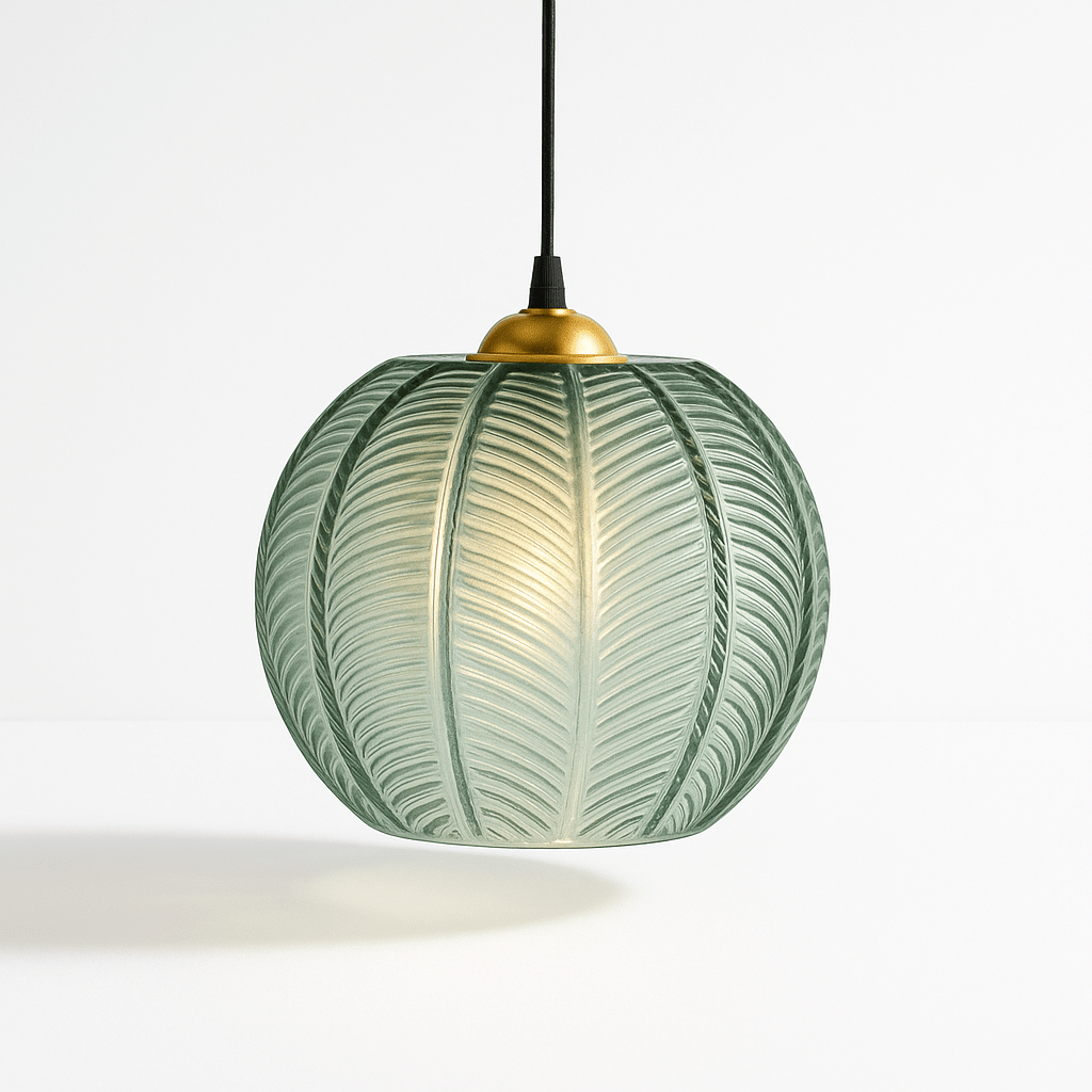 Clérachic ribbed opaline glass pendant light in sage green, brass canopy, glowing warm against a plain white backdrop.
