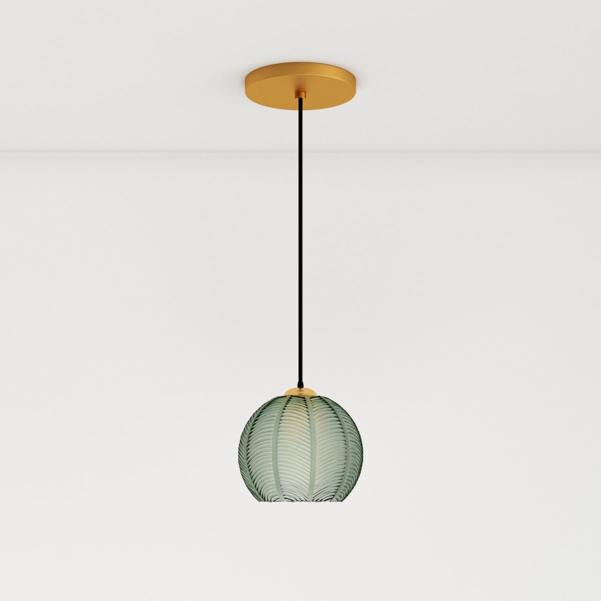 Clérachic ribbed opaline glass pendant light in sage green on a long cord from a brass canopy, glowing warm white.