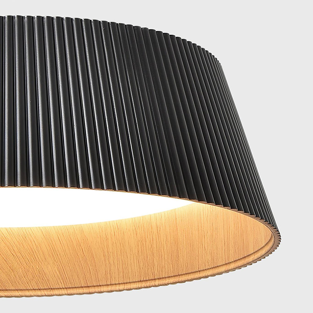 Close view of the fine black ribs and the wood-grain inside edge of this Clérachic ceiling light.