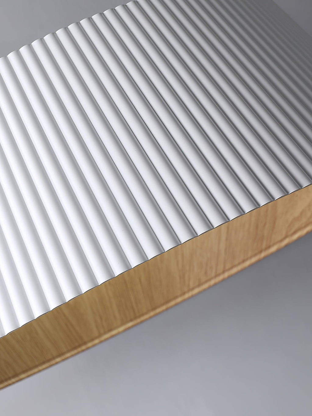 Close view of the white vertical ribbing and wood-grain interior edge on this Clérachic ceiling light.