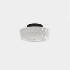 Three-quarter view of the Clérachic fluted opal glass flush ceiling light in white, unlit on a plain backdrop.