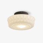 The white Clérachic fluted opal glass flush ceiling light switched on, glowing warm through the fluted glass.