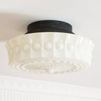The white Clérachic fluted opal glass flush ceiling light photographed close, unlit, showing its fluted band.