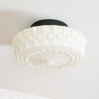 A second close studio angle of the unlit white Clérachic fluted opal glass flush ceiling light and its canopy.