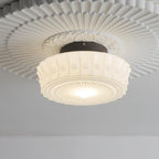 Upward view of the white Clérachic fluted opal glass flush ceiling light with its fluted rosette filling the ceiling.