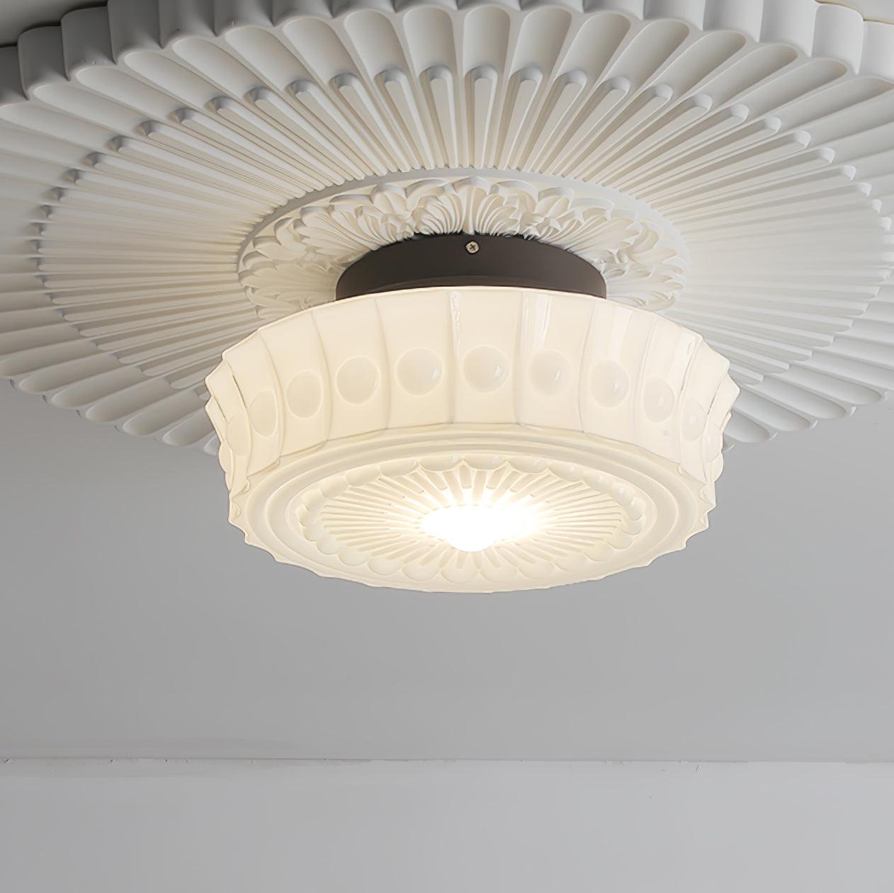 Upward view of the white Clérachic fluted opal glass flush ceiling light with its fluted rosette filling the ceiling.