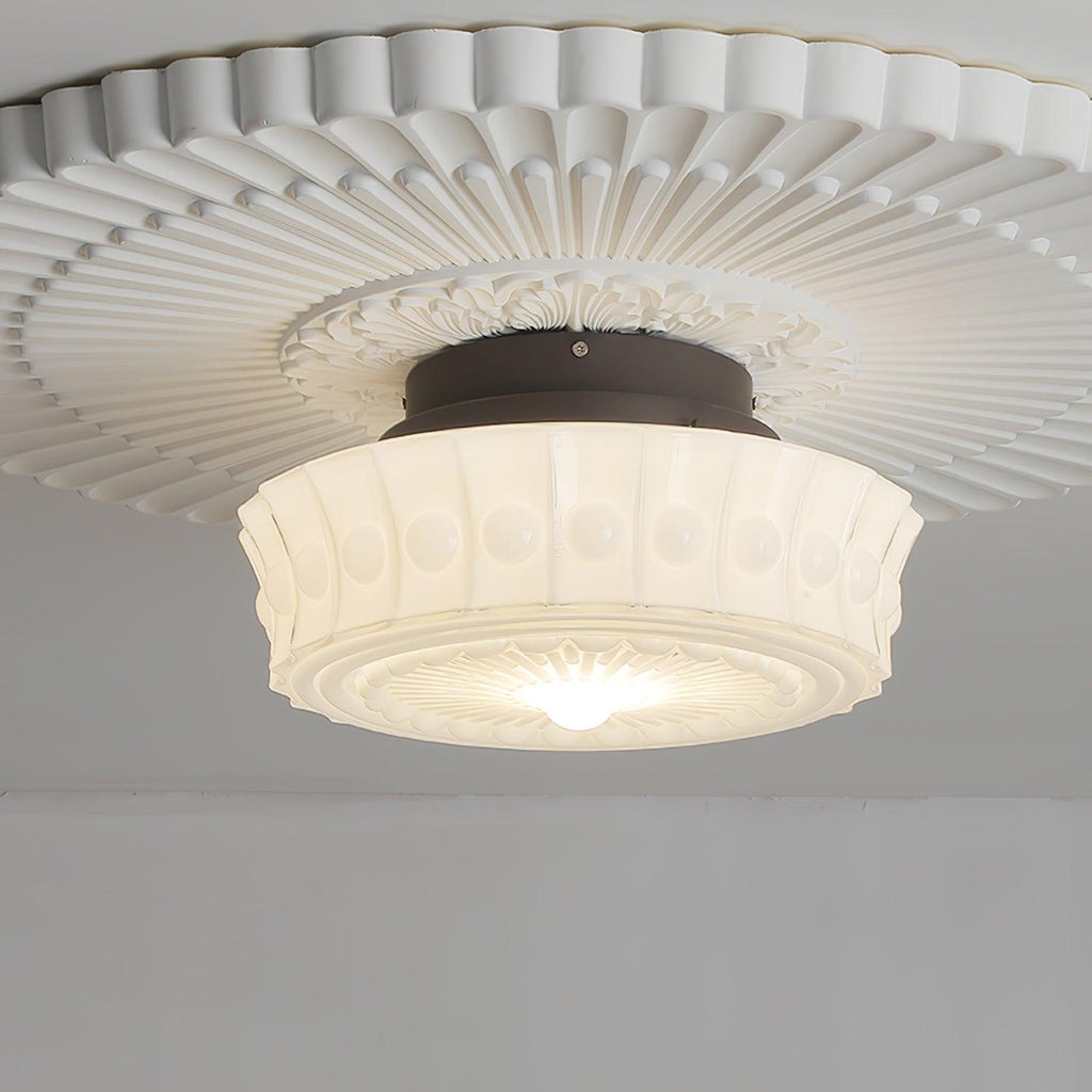 A wide upward angle of the white Clérachic fluted opal glass flush ceiling light radiating light from the ceiling.