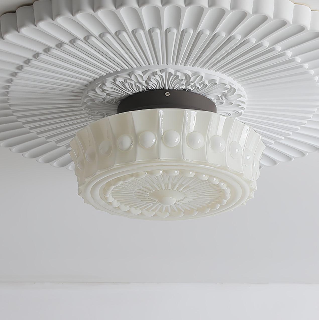 Close upward shot of the white Clérachic fluted opal glass flush ceiling light with its full fluted rosette.