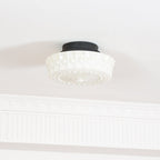 Close studio detail of the unlit white Clérachic fluted opal glass flush ceiling light and its raised bosses.
