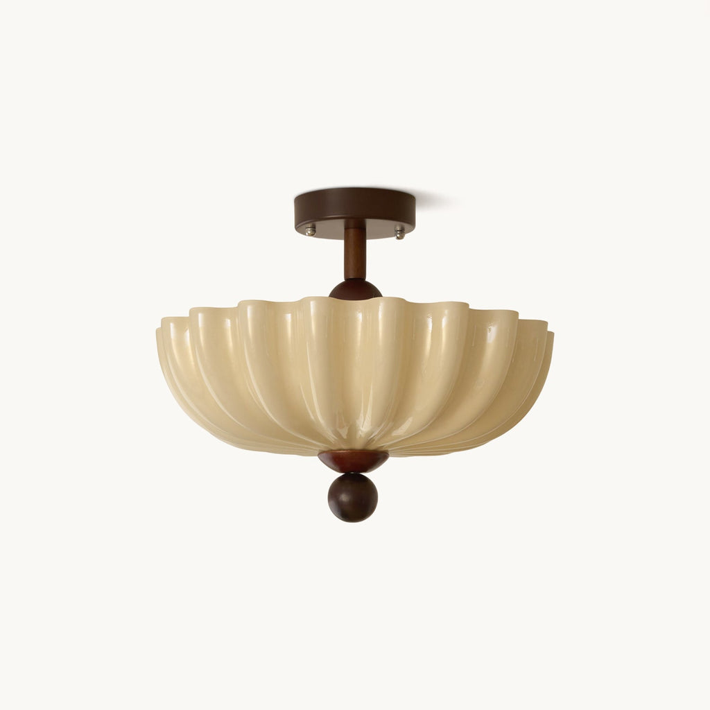 Scalloped cream glass shade on a short walnut-brown stem with a round ball finial, a Clérachic flush ceiling light on white.