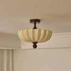 Unlit scalloped shade with walnut canopy and ball tip, this Clérachic ceiling light seen against a cream ceiling and cornice.