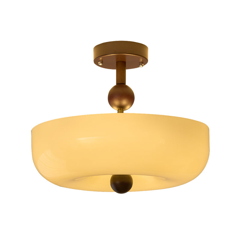 Lit smooth cream bowl shade with a walnut ball finial, this Clérachic ceiling light photographed on a plain white background.