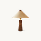 Conical beige fabric shade with a wooden cap on a fluted walnut base, this Clérachic table lamp shown on a plain white backdrop.