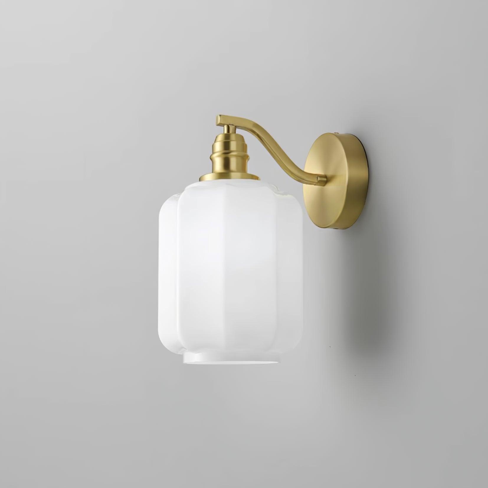 Clérachic Fluted White Glass Wall Sconce unlit on grey, the arm reaching just 12 cm / 4.7″ off the wall from a round backplate.
