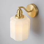 The Clérachic Fluted White Glass Wall Sconce seen from above, the arm sweeping down from the backplate to the socket collar.