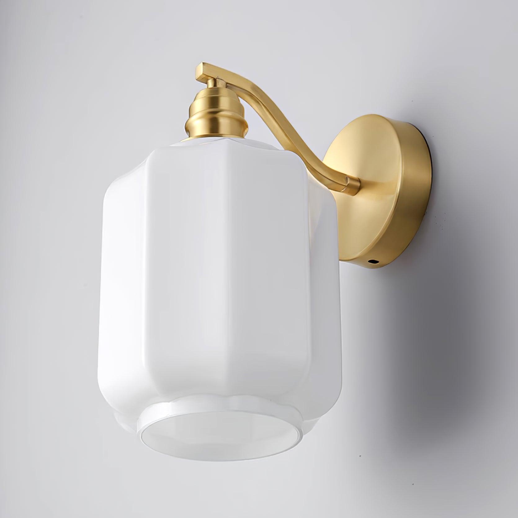 Three-quarter view of the Clérachic Fluted White Glass Wall Sconce from below, the open rim and rounded square shade in frame.