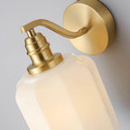 Close-up of the stepped brass socket collar on the Clérachic Fluted White Glass Wall Sconce, above the scalloped glass shoulder.