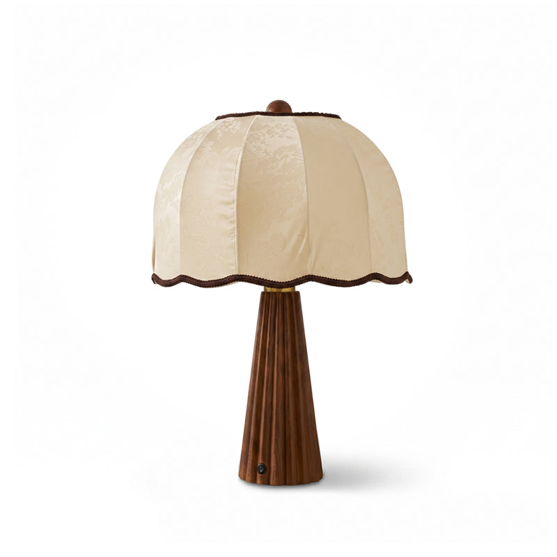Clérachic table lamp with a cream jacquard dome shade and walnut-colour fluted base, unlit on a white background.