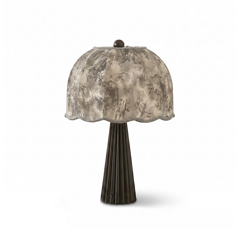 Clérachic table lamp unlit on white, a grey bamboo-print dome shade above a dark fluted base.