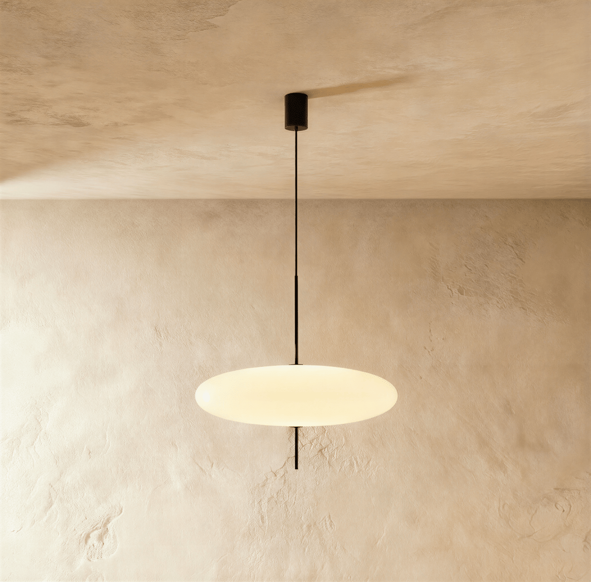 Clérachic all-white saucer pendant with a smooth glowing acrylic diffuser on a thin black rod from a black ceiling canopy.