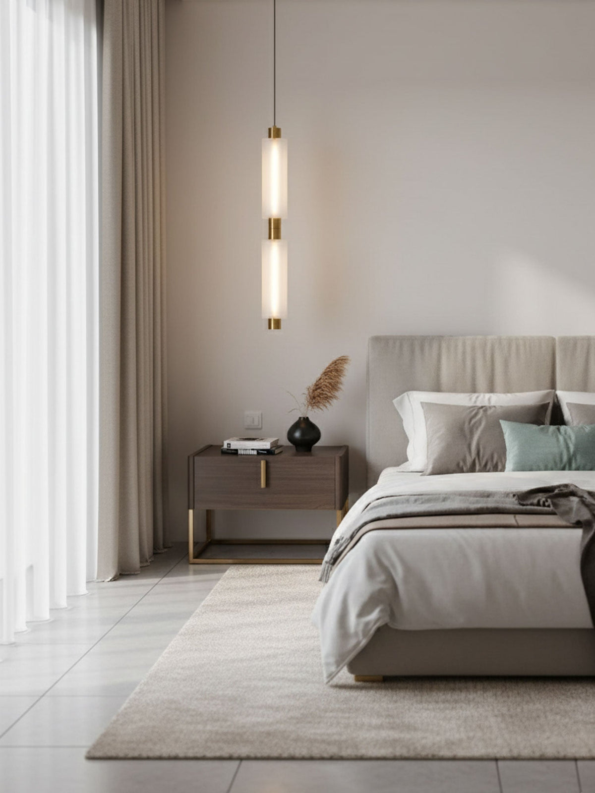 A single two-head Clérachic pendant hangs beside a bed in a pale bedroom with long curtains and a woven rug.