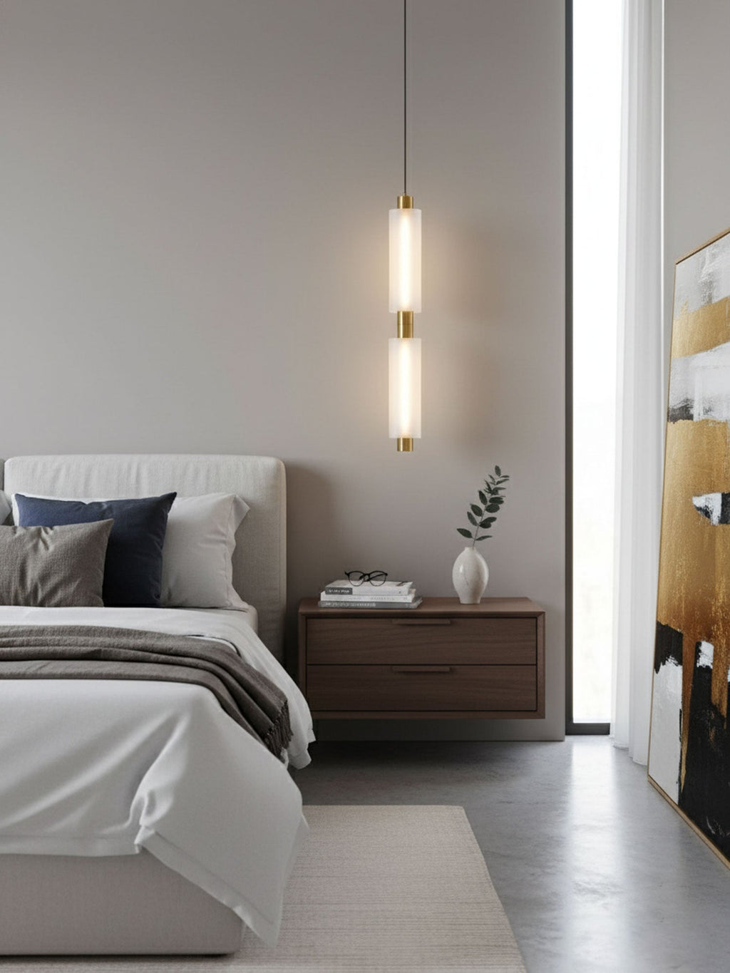 A two-head Clérachic pendant with a gold joint hangs at a bedside, near a floor-length window and a framed painting.