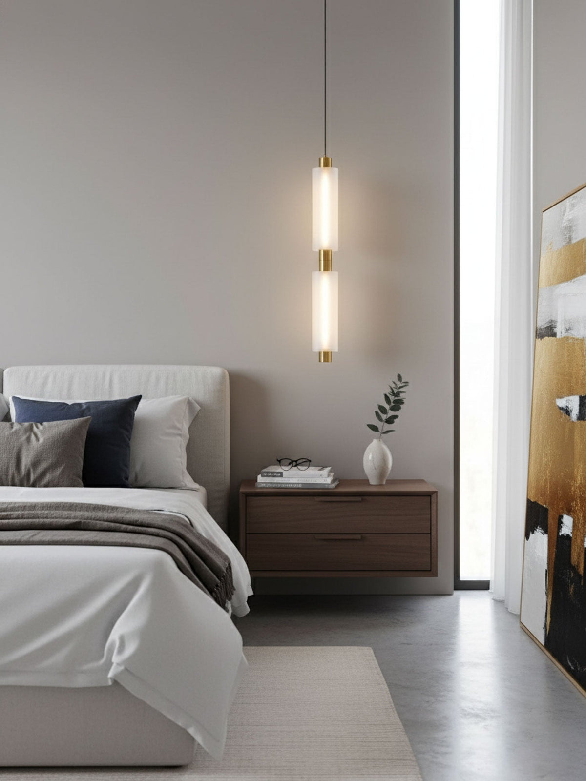 A two-head Clérachic pendant with a gold joint hangs at a bedside, near a floor-length window and a framed painting.