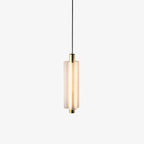 A frosted white Clérachic pendant with a gold cap and base, hung on a black cable against a white backdrop.
