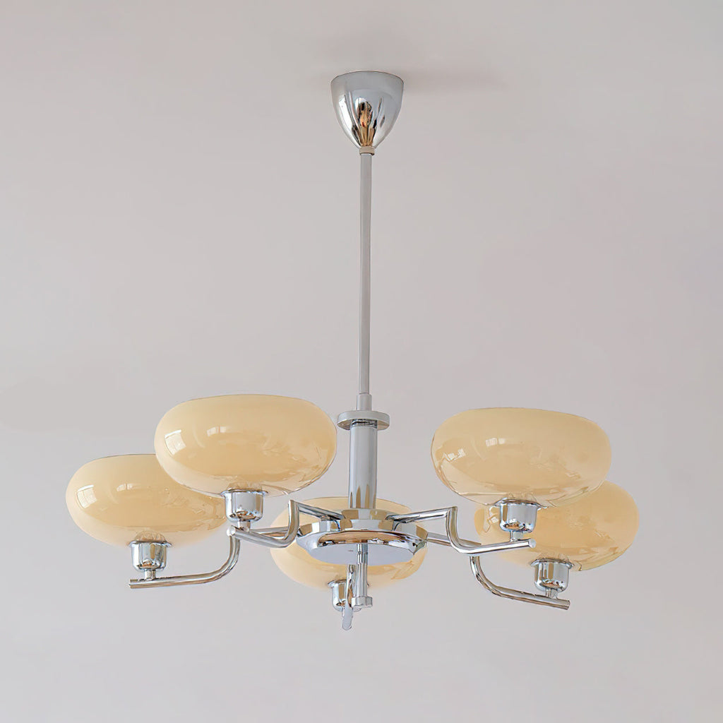 Chrome Clérachic chandelier unlit, its sand-beige glass domes and polished arms hanging below a silver canopy.