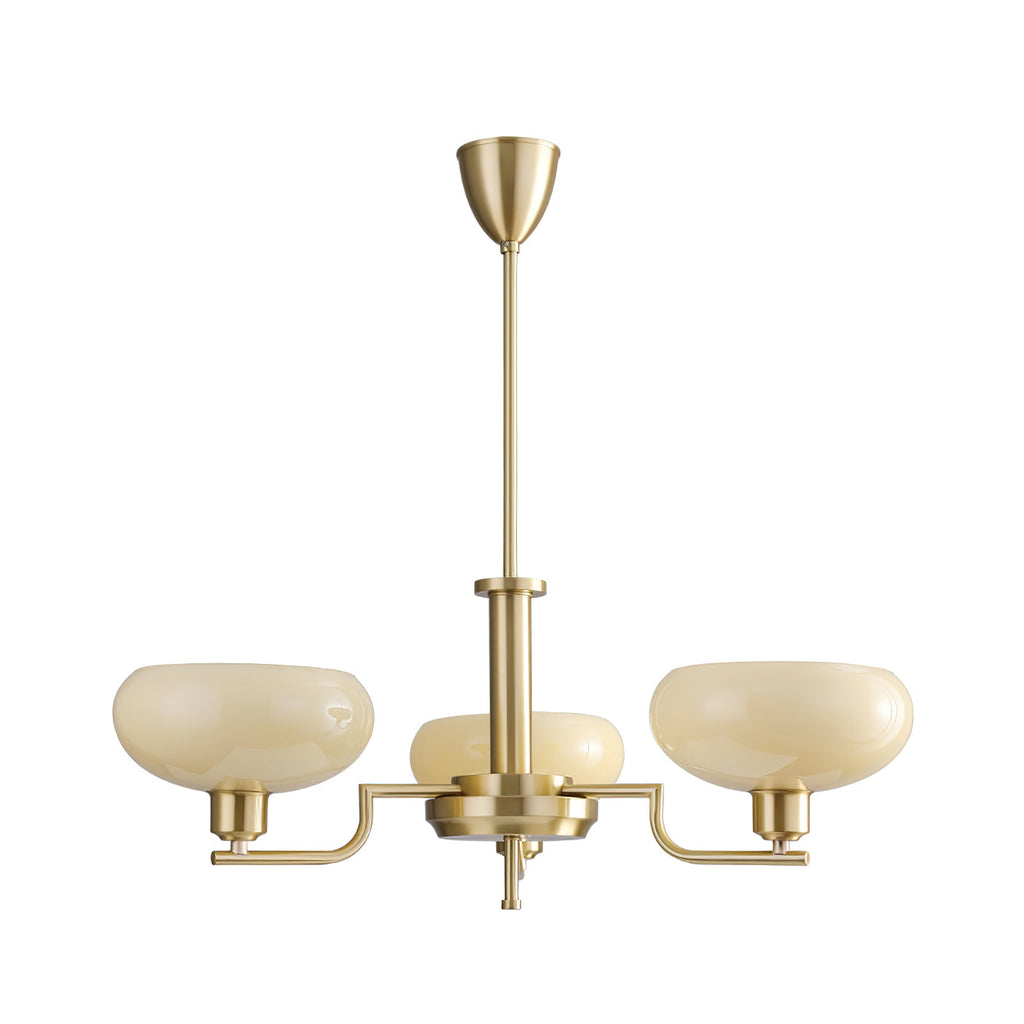 Three-head gold Clérachic chandelier on a white backdrop, wide pale glass domes on brass arms with a tall stem.