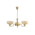Smaller three-head gold Clérachic chandelier on white, three pale beige glass domes on slim brass arms.