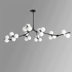 Black chandelier with a full spread of white glass globes on thin angled branches, shown on a light grey backdrop; from Clérachic.