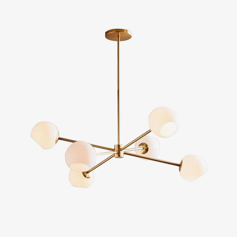 Gold six-light chandelier from Clérachic with white globes on slim arms, shown on a clean white backdrop.