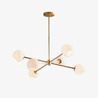 Gold six-light chandelier from Clérachic with white globes on slim arms, shown on a clean white backdrop.