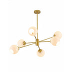 Gold Clérachic chandelier with six white opal globes spread on slim arms, with a bulb visible in the upper-left shade.