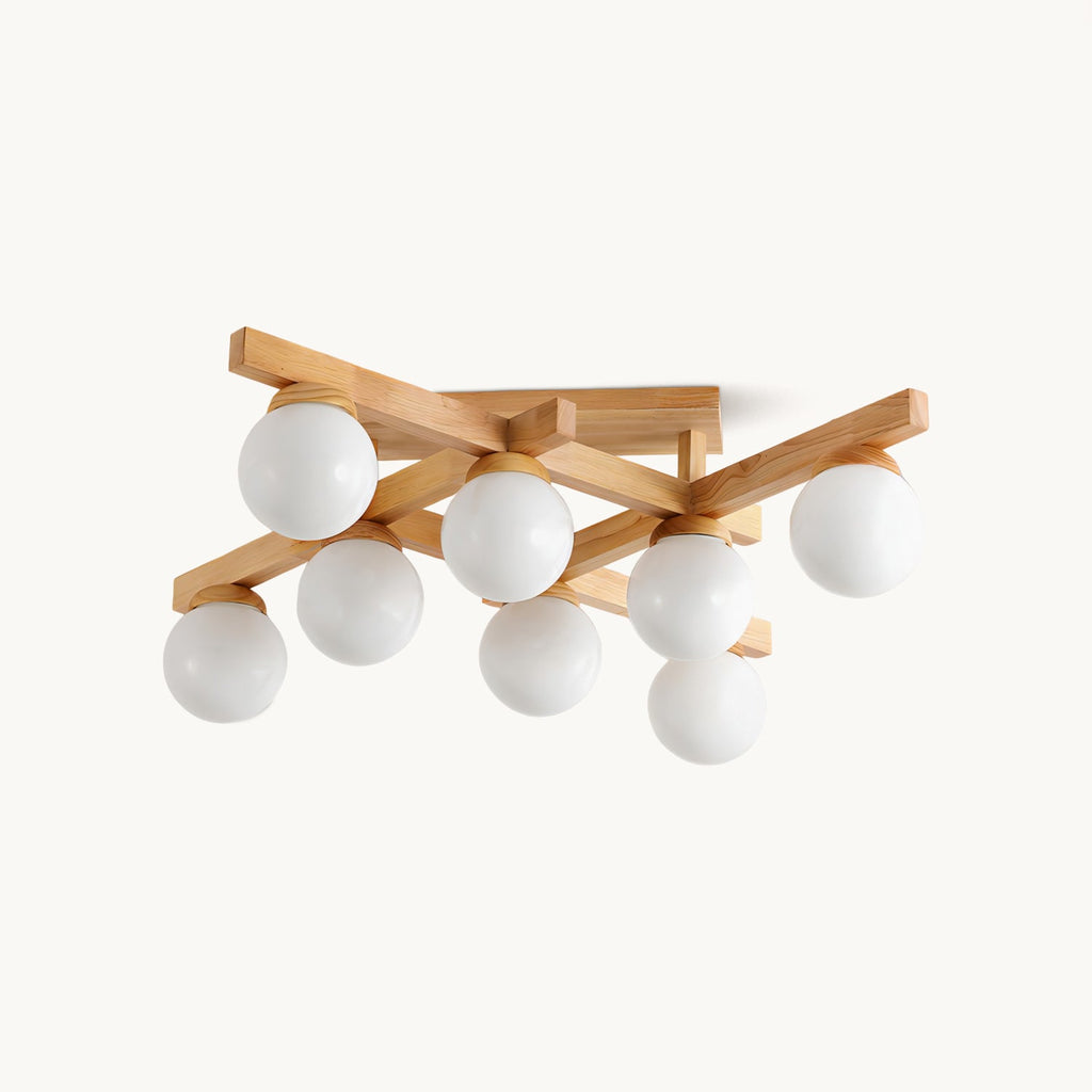 Eight frosted white globes on crossed wood arms, this Clérachic flush-mount ceiling light shown on a plain white backdrop.