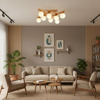Wood and frosted glass Clérachic ceiling light in a living room with a linen sofa, two armchairs, round side tables and a large leafy plant.
