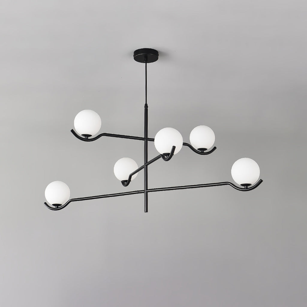 Seen from below against a grey ceiling, this Clérachic chandelier holds five frosted globes on curved black arms.