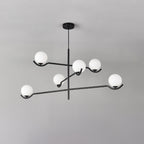 Seen from below against a grey ceiling, this Clérachic chandelier holds five frosted globes on curved black arms.