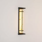 Unlit tall Clérachic wall light seen from a slight angle, showing golden veins in the pale shade and the slim dark metal frame.