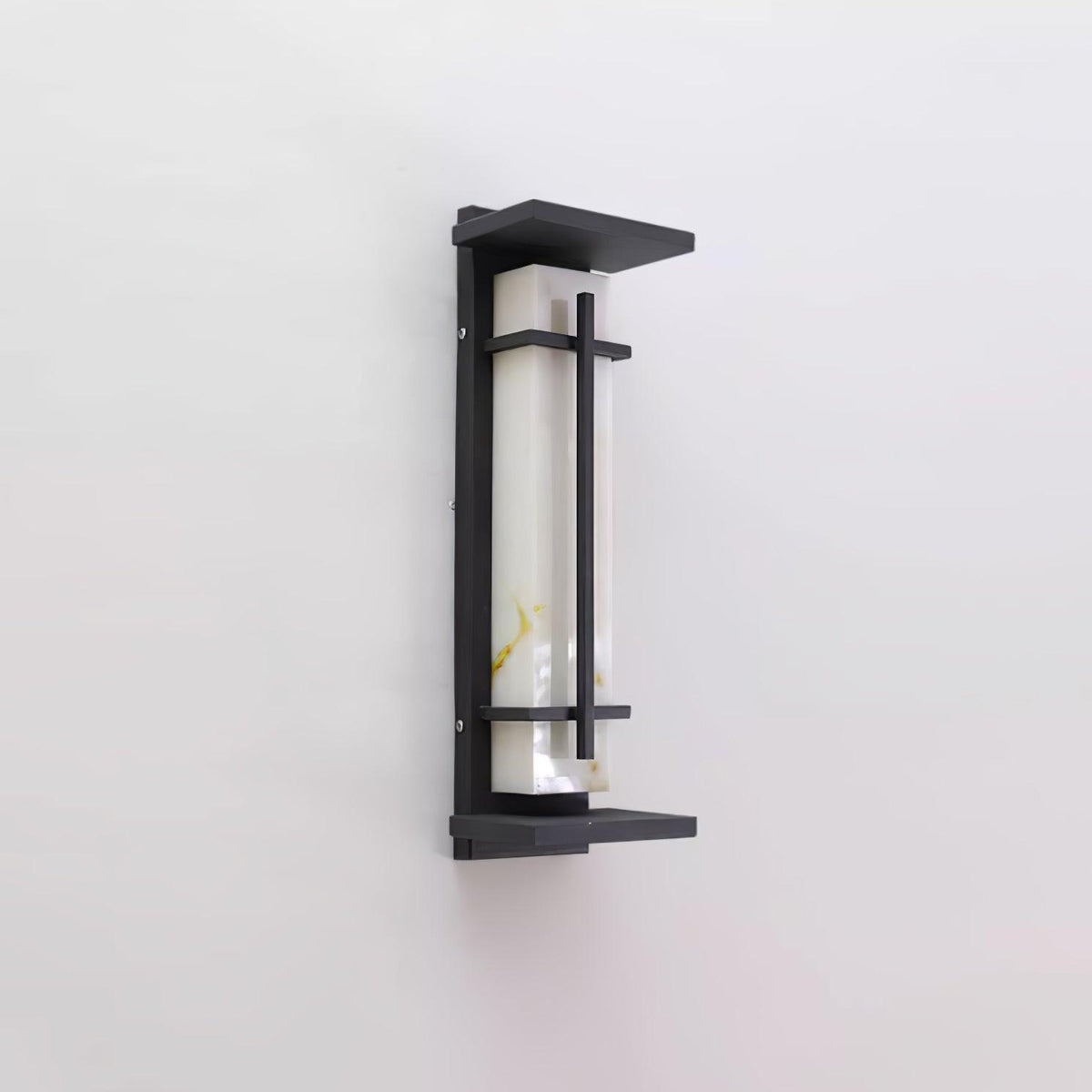 Side-angled view of the unlit wall light, showing the deep dark frame, the top canopy and the marbled pale shade; from Clérachic.