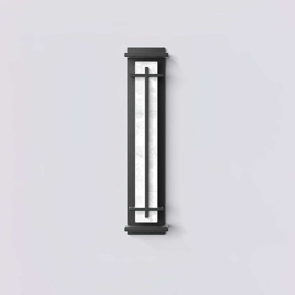 Front view of an unlit wall light, the white marbled shade behind a dark frame, against a pale grey wall; from Clérachic.