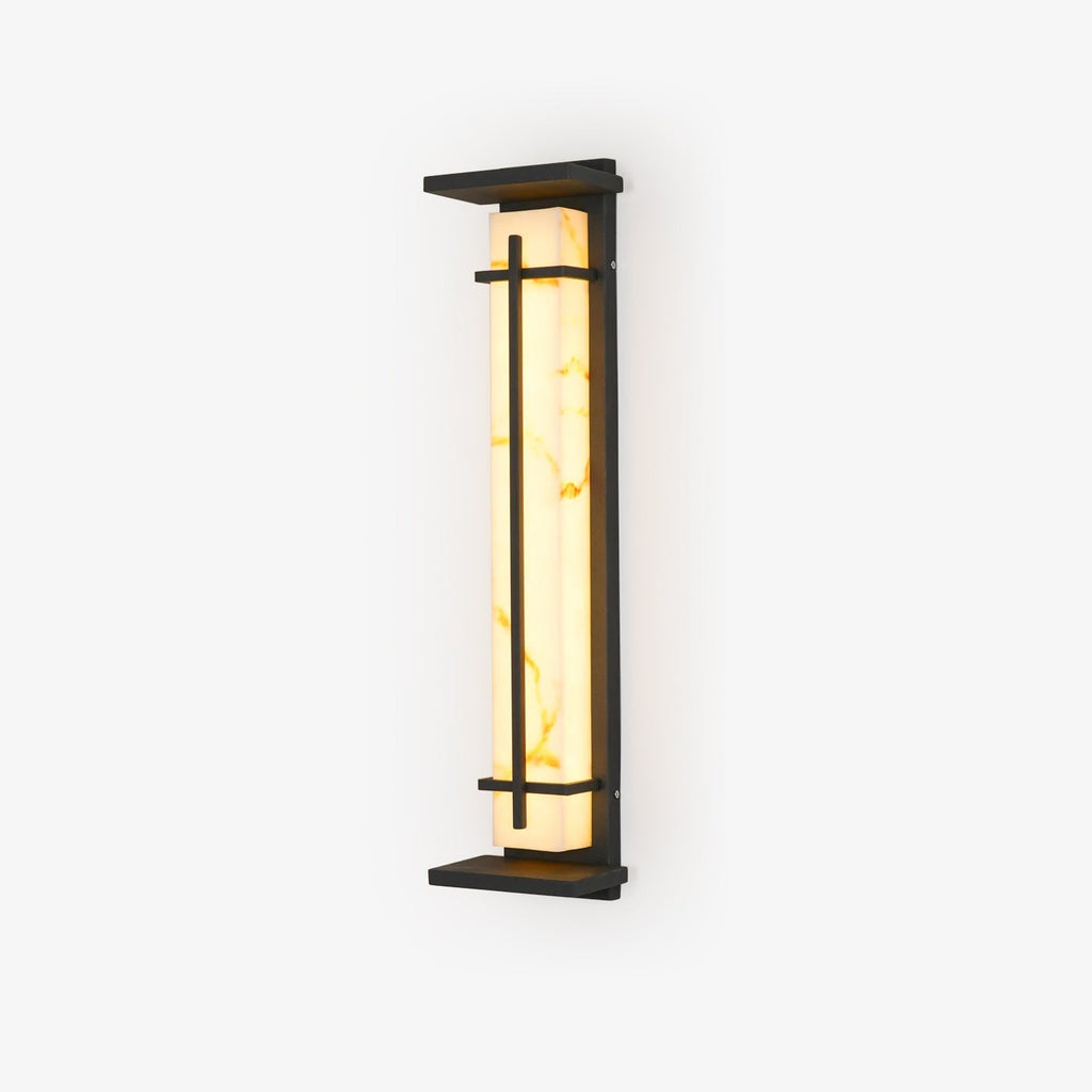 Lit wall light with golden veining visible in the pale shade, dark frame and top canopy, on a white backdrop; this Clérachic design.