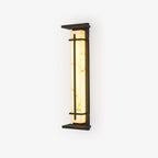 Lit wall light with golden veining visible in the pale shade, dark frame and top canopy, on a white backdrop; this Clérachic design.